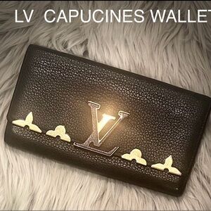 Louis Vuitton large women’s wallet in black with gold hardware